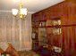 The living room and the cupboard
