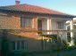11044:1 - Pretty brick house with a garden featuring many fruit trees
