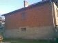 11044:3 - Pretty brick house with a garden featuring many fruit trees